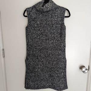 Robert Kitchen sleeveless tunic sweater with side slits.